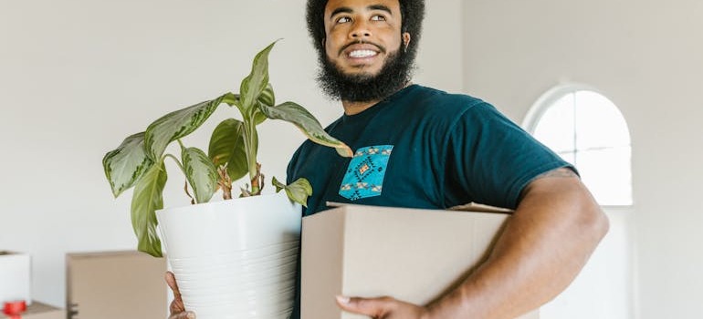 One of the movers of BR Moving holding items