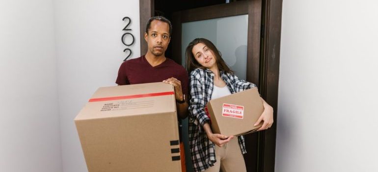 couple holding boxes