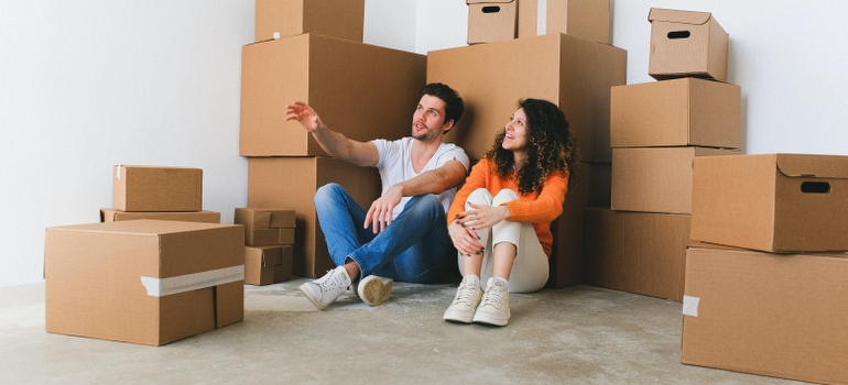 Couple talking after movers in Media PA delivered their items to their new home