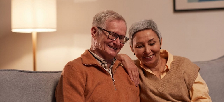 old couple looking at a laptop