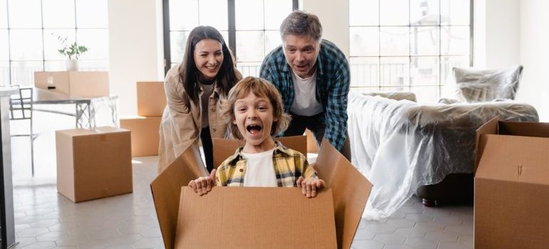 family having fun after moving